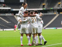 Carlton Morris celebrates after scoring for Milton Keynes Dons, to extend their lead making it 2 - 0 against Gillingham, during the Sky Bet...