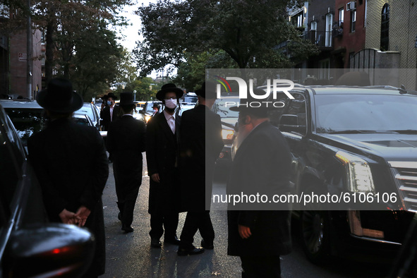 Worshipers of the Congregation Yetev Lev D'Satmar synagogue gather outside New York Citys' neighborhood of Williamsburg in the borough of Br...