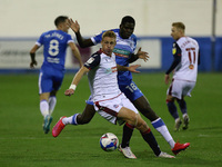  Yoan Zouma of Barrow in action with Eoin Doyle of Bolton Wanderers    during the Sky Bet League 2 match between Barrow and Bolton Wanderers...