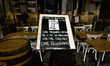 A sign in front of a restaurant in Campo Dei Fiori, Rome, Italy, on October 23, 2020 amid...
