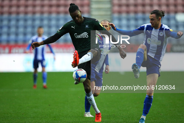 Plymouths Jerome Opoku battles with Wigans Will Keane during the Sky Bet League 1 match between Wigan Athletic and Plymouth Argyle at the DW...