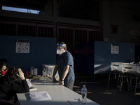 Chilean people at the polling station  during the national referendum, on October 25, 2020 in Santiago, Chile. (