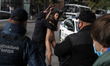 (EDITOR'S NOTE: Image contains nudity.) Police officers detain a FEMEN women movement acti...