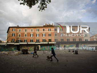    A young boy walks with his dog in  Trastevere district as Italy is facing a surge in the coronavirus disease (COVID-19) infections in Rom...
