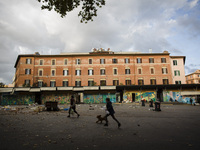    A young boy walks with his dog in  Trastevere district as Italy is facing a surge in the coronavirus disease (COVID-19) infections in Rom...