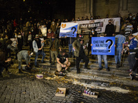   Bartenders pour beer on the ground during a protest against latest Coronavirus restrictions in Trilussa square as Italy is facing a surge...