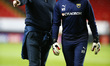 Karl Robinson manager of Oxford United and Goalkeeping coach: Wayne Brown during the pre-m...