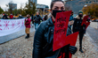 Two women are holding placards with the red symbol against the abortion ban, during the pr...
