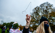 A woman is holding a coat hanger, in solidarity with Polish women, during the protest agai...