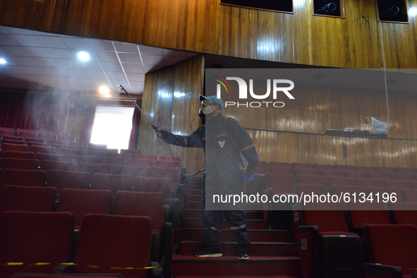 A worker sprays disinfectant solution as precautionary measure  inside of the Hidalgo theater. Has been allowed resumption of Mexico City's...