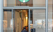 A store front of a Starbucks Coffee shop located in Midtown Manhattan with people walking...