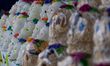 Sugar Skulls are seen in  outdoor market, sugar skulls are used as ornaments in offerings...