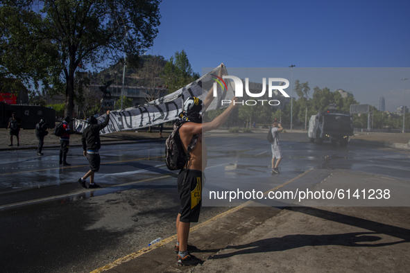 A person holds a canvas on October 30, 2020 in Santiago de Chile, Chile.
Amid of the demonstration and protest for the freedom of political...
