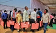 Election officials leave for their respective polling stations after collecting Electronic...