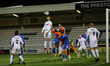 Torquay United's Kyle Cameron heads clear from a corner during the Vanarama National Leagu...