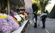 Two women buy some flowers during the All Saints festivities in Spain. People decided to g...