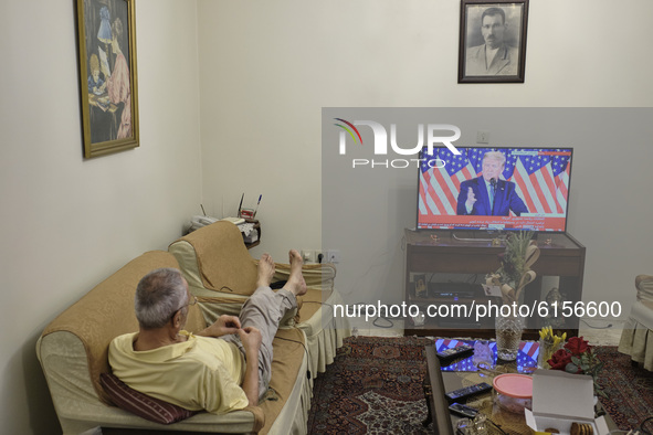 An Iranian man watches television as the U.S. President Donald Trump addresses during a TV program on November 4, 2020 in Tehran, Iran.  