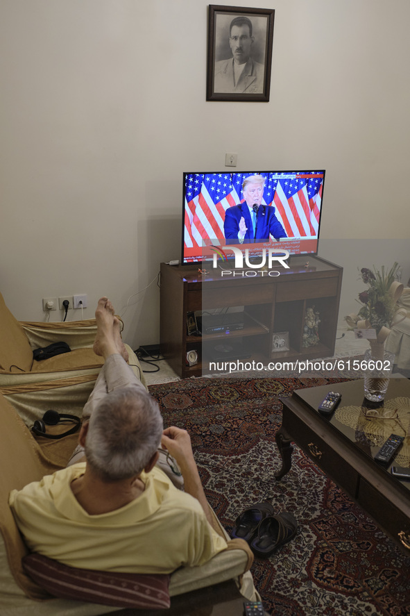 An Iranian man watches television as the U.S. President Donald Trump addresses during a TV program on November 4, 2020 in Tehran, Iran.  
