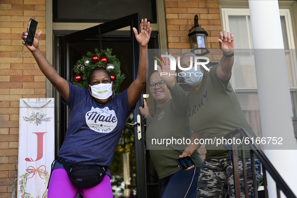 People react on the streets of Mt Airy, in Northwest Philadelphia, PA, USA moment after Joe Biden is announced to be the winner of the 2020...