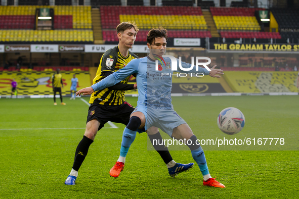 Callum O'Hare of Coventry City and James Garner of Watford during the Sky Bet Championship match between Watford and Coventry City at Vicara...