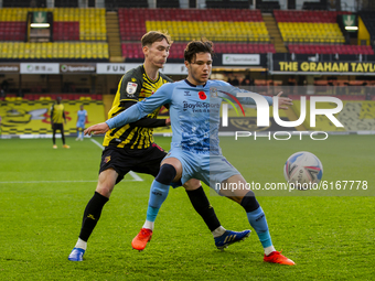 Callum O'Hare of Coventry City and James Garner of Watford during the Sky Bet Championship match between Watford and Coventry City at Vicara...