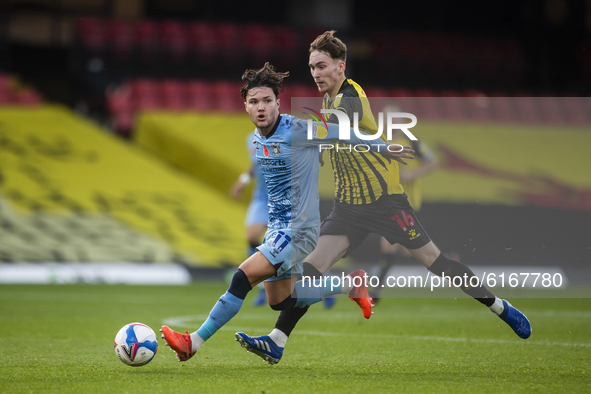 James Garner of Watford and Callum O'Hare of Coventry City during the Sky Bet Championship match between Watford and Coventry City at Vicara...
