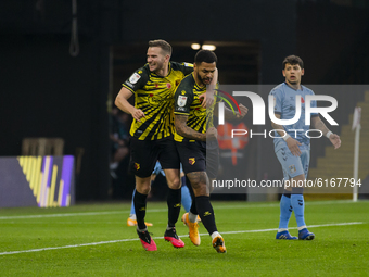 Troy Deeney of Watford celebrates scoring his sides first goal during the Sky Bet Championship match between Watford and Coventry City at Vi...