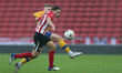  George Dobson of Sunderland battles with George Maris of Mansfield Town during the FA Cup...