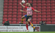  Sunderland's Will Grigg contests a header with Farrend Rawson of Mansfield Town  during t...