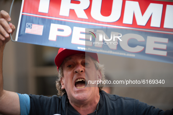 Donald Trump supporters gather in front of the  Pennsylvania Convention Center, claiming that Biden and the Democrats were stealing the elec...