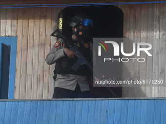 The police conducted a search for fugitive terrorists at the location suspected of being their hiding place in Mamboro Village, North Palu,...