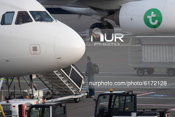Passengers seen boarding in aircraft at Eindhoven Airport EIN EHEH in the Netherlands during the Coronavirus Covid-19 pandemic era. Each pas...