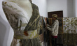 A worker is seen arranging a leaf-patterned cloth for sale at the Arae production gallery,...