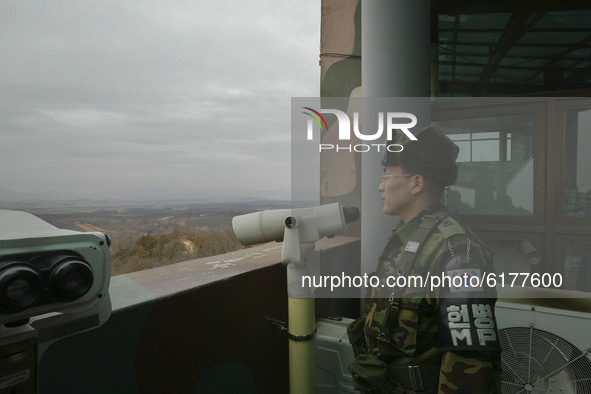 Military officer look demilitarized zone and North Korean gaepung vill, view from Odusan military observation post in Paju, South Korea on F...