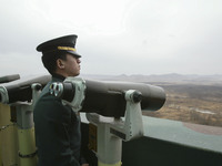 South Korean Army cadet look demilitarized zone and North Korean gaepung vill, view from Odusan military observation post in Paju, South Kor...