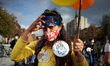 A protester wears a sticker reading 'Let's us breathe, down with masks'. Teachers proteste...