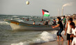Palestinians enjoy a day at the beach of the Mediterranean Sea on the coast of Gaza City,...