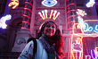 British artist Chila Kumari Singh Burman poses with her neon light installation 'Rememberi...