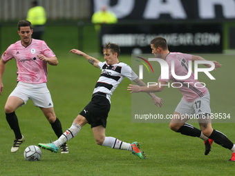 Darlington's Jarrett Rivers in action with Andy Bond and Zak Lilly of AFC Telford  during the Vanarama National League North match between D...