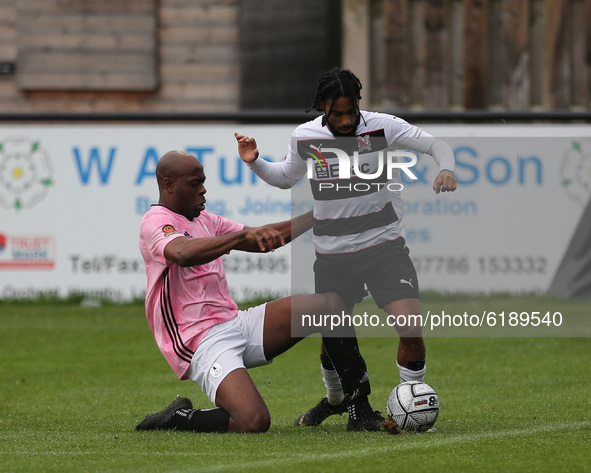 Theo Streete of AFC Telford battles with Darlington's Erico Sousa during the Vanarama National League North match between Darlington and AFC...