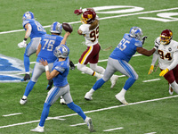 Detroit Lions quarterback Matthew Stafford (9) throws a pass to wide receiver Marvin Hall (17) for a touchdown during the first half of an N...