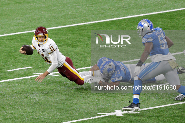 Washington Football Team quarterback Alex Smith (11) is sacked by Detroit Lions defensive end Romeo Okwara (95) during the first half of an...
