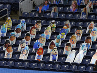 Cutout photos of characters from the online game Animal Crossing are placed in the spectator seating area near the endzone during the first...