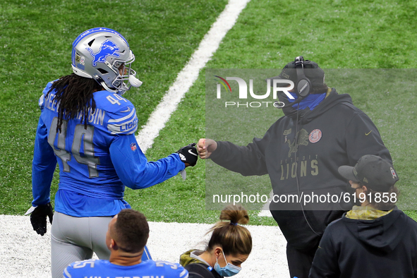 Head coach Matt Patricia of the Detroit Lions fist bumps linebacker Jalen Reeves-Maybin (44) of the Detroit Lions on the sidelines before th...