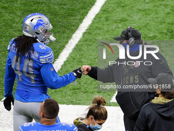 Head coach Matt Patricia of the Detroit Lions fist bumps linebacker Jalen Reeves-Maybin (44) of the Detroit Lions on the sidelines before th...