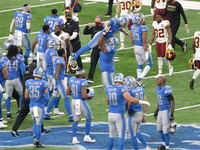 Detroit Lions kicker Matt Prater (5) celebrates with Detroit Lions offensive tackle Tyrell Crosby (65) after making the field goal for a 30-...