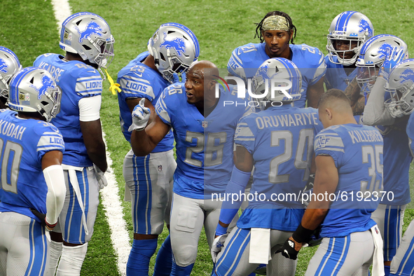 Strong safety Duron Harmon (26) of the Detroit Lions talks with teammates before the first half of an NFL football game between the Washingt...