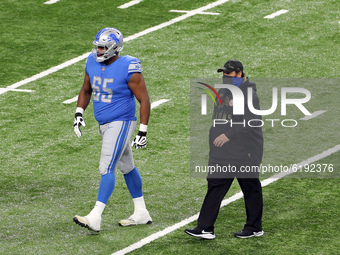 Head coach Matt Patricia of the Detroit Lions walks off the field with offensive tackle Tyrell Crosby (65) of the Detroit Lions of the Detro...