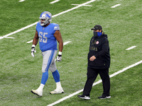 Head coach Matt Patricia of the Detroit Lions walks off the field with offensive tackle Tyrell Crosby (65) of the Detroit Lions of the Detro...