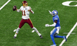 Quarterback Alex Smith (11) of the Washington Football Team looks to pass the ball during...